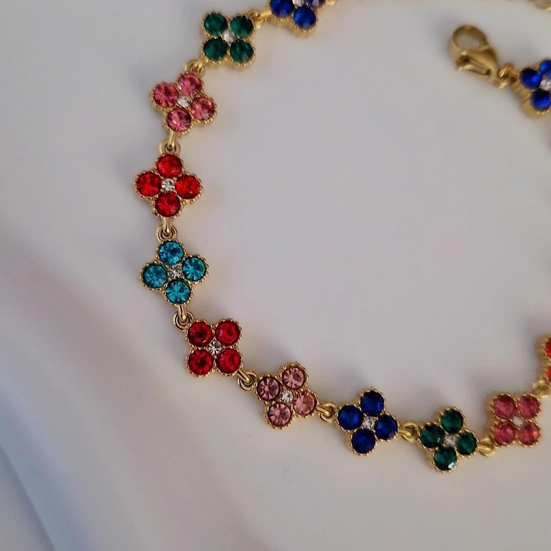 Bracelet en acier inoxydable avec fleurs multi strass colorés