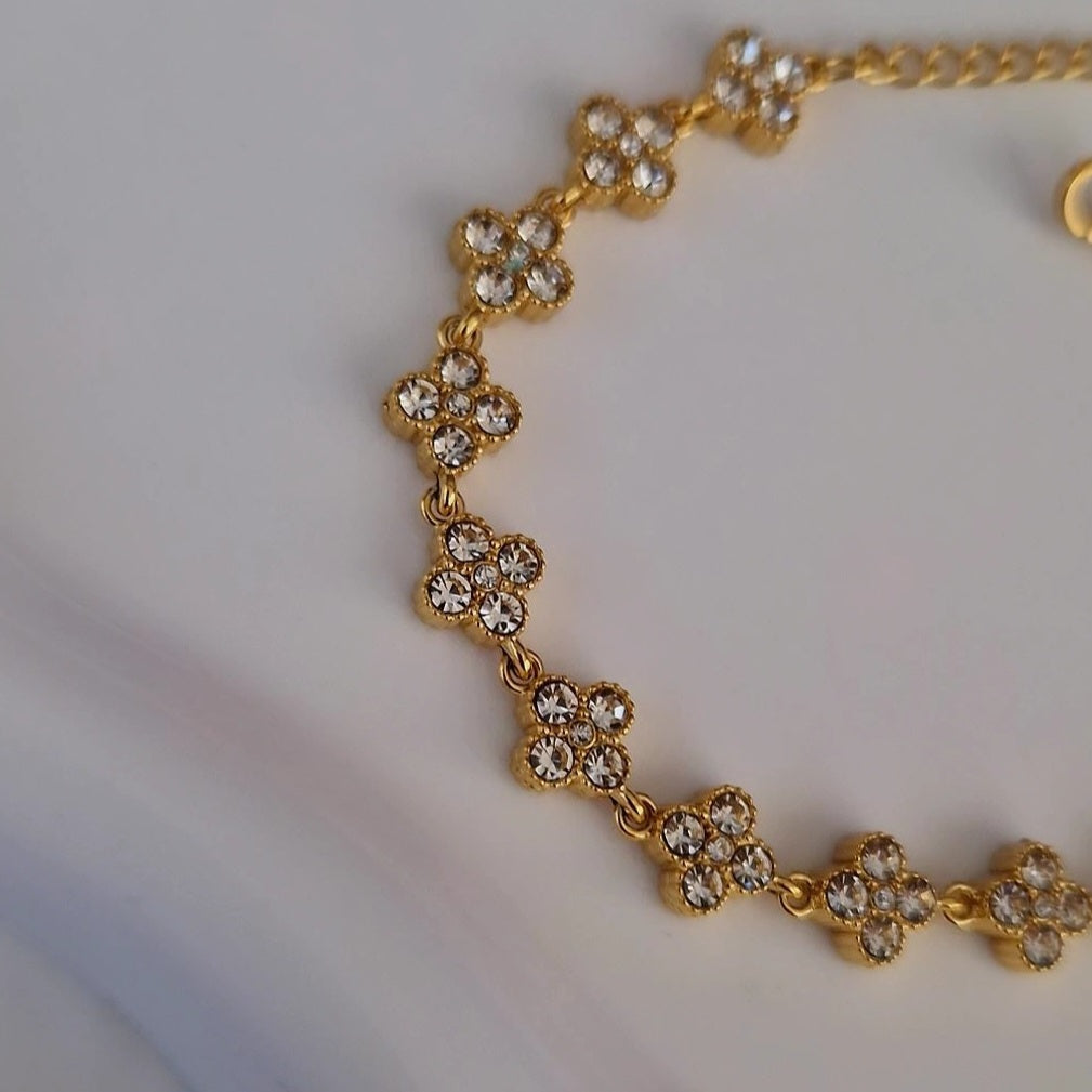Bracelet en acier inoxydable avec fleurs multi strass