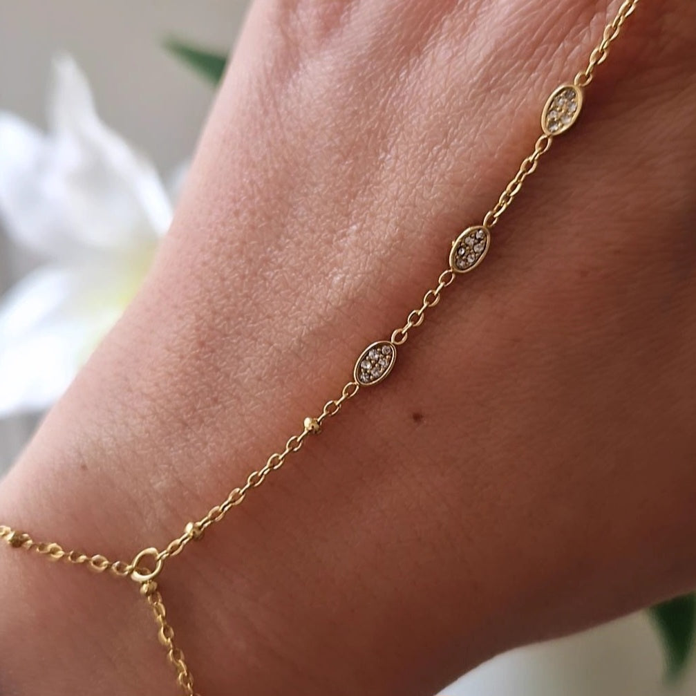 Chaîne de main / Bracelet en acier inoxydable billes dorées mini ovale et strass