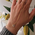 Chaîne de main / Bracelet en acier inoxydable billes dorées rond et strass