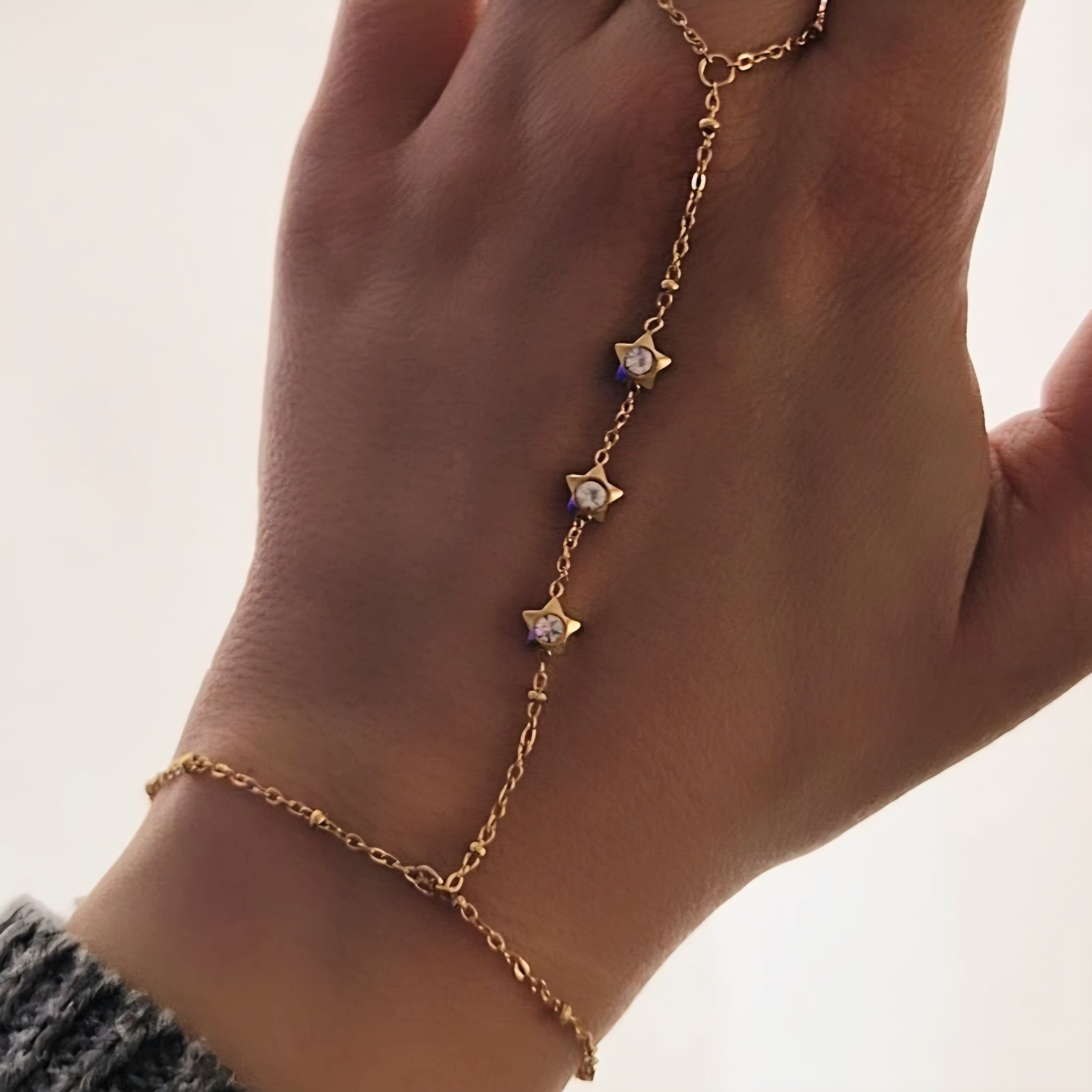 Chaîne de main / Bracelet en acier inoxydable billes dorées étoiles et strass