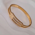Bracelet jonc en acier inoxydable triple lignes et strass