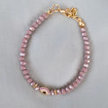 Bracelet fantaisie perles violettes œil