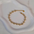 Bracelet en acier inoxydable avec fleurs multi strass