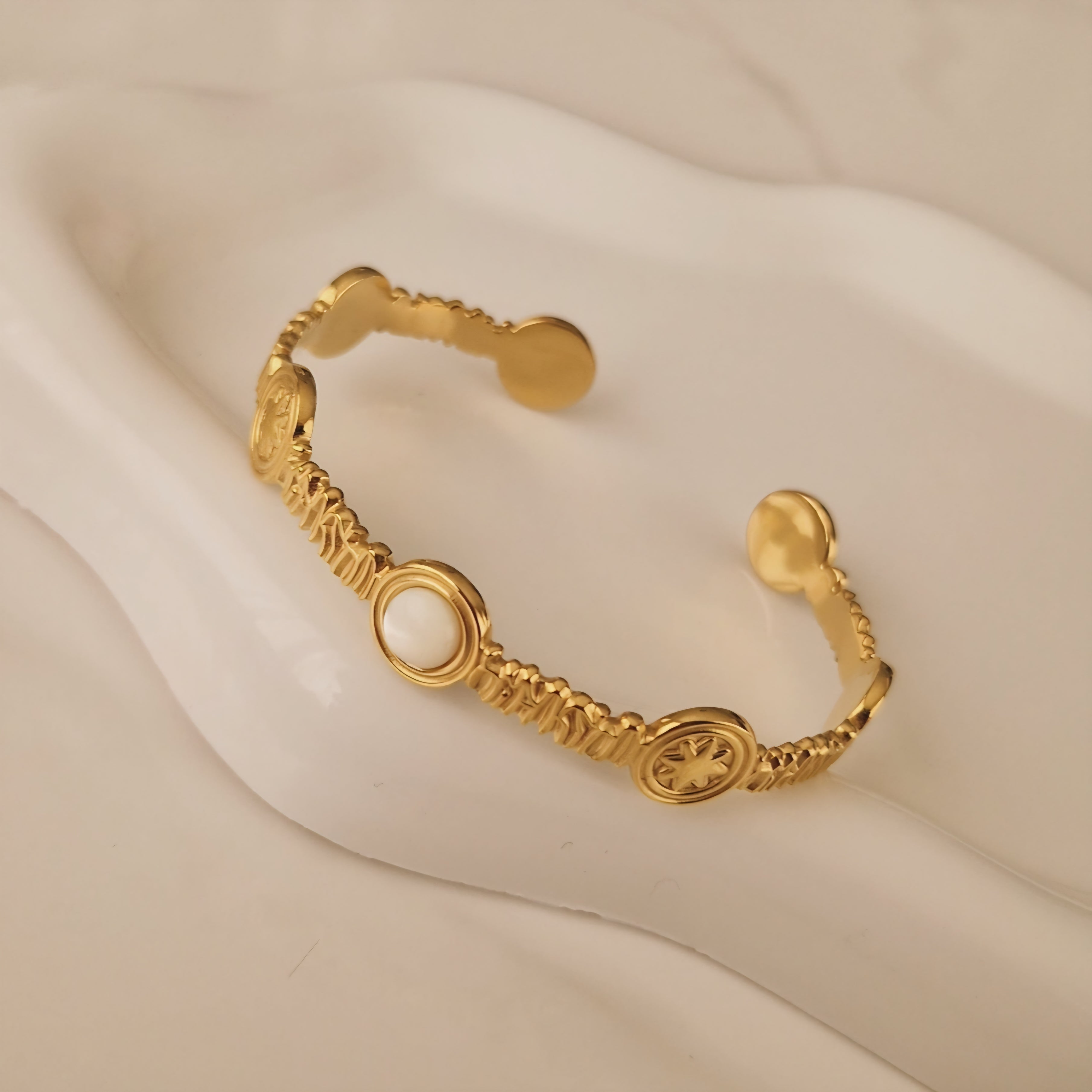 Bracelet jonc en acier inoxydable soleil et pierre blanche